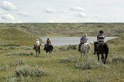 Riders on the prairie head towards the South Saskatchewan river